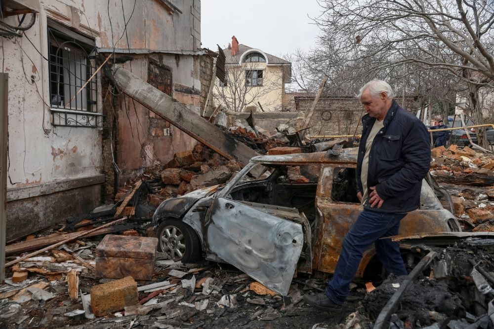 A resident is seen at the site of an apartment building in Odesa, Ukraine, March 4, hit by a Russian drone strike. (OSV News/Reuters/Nina Liashonok)