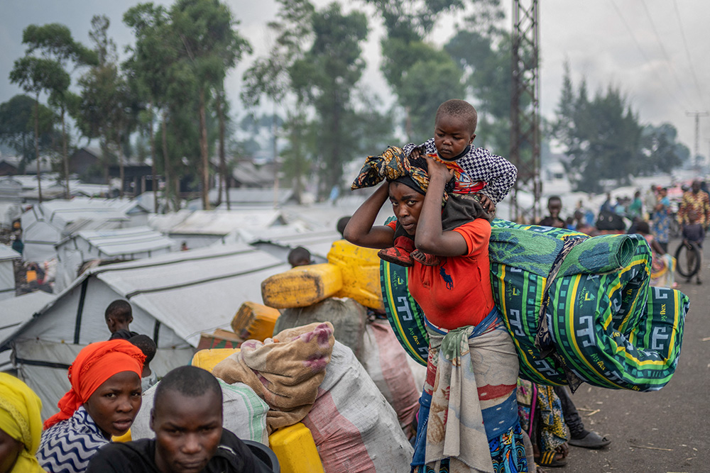 Congolese people displaced by recent clashes between the M23 rebels and the armed forces of the Democratic Republic of the Congo prepare to leave a camp Feb. 12, 2025, and return home after being instructed by the M23 rebels to vacate camps on the outskirts of Goma, Congo. (OSV News/Reuters)