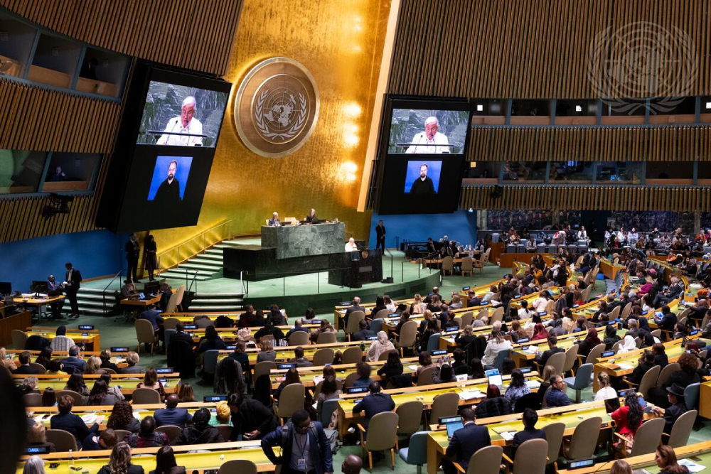 Antonio M. Lagdameo, the permanent representative of the Philippines to the United Nations and chair of the Committee on the Status of Women in 2024, pictured at the podium and upper part of screens addressing the opening of the 68th session of the CSW in March 2024.