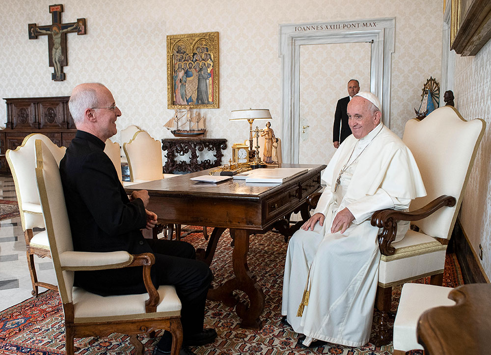 Pope Francis smiles during a private meeting with Jesuit Fr. James Martin at the Vatican Oct. 1, 2019. (CNS/Vatican Media)