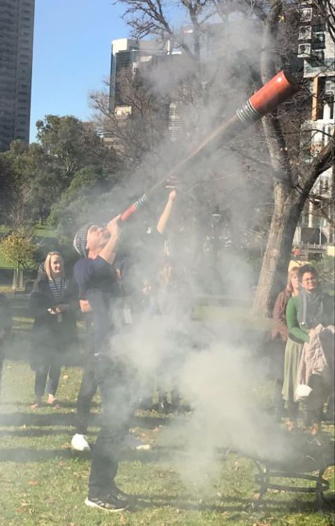 Indigenous elder Ash Dargan plays the didgeridoo, a sacred instrument, during a National Reconciliation Week ceremony in 2022. 