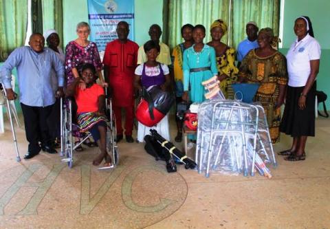 Sr. Rita Schwarzenberger, third from the left, takes a photo with members of the community who have received walking aids. (Provided photo)