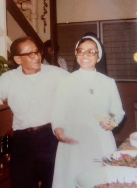 Terri Laureta celebrates her father's birthday upon arriving from Syracuse, surrounded by friends and relatives at their home. The image is approximately 40 years old. (Courtesy of Terri Laureta)