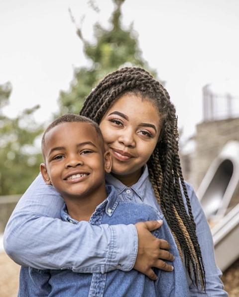 A'ja Ross, a former resident at St. Ann's Center for Children, Youth and Families, hugs her son, Ti'Andre Williams. (Courtesy of A'ja Ross)