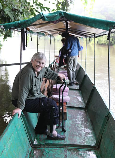 Sr. Judy Bisignano sits on a boat along an Amazon river. (Courtesy of Sandra Morse)