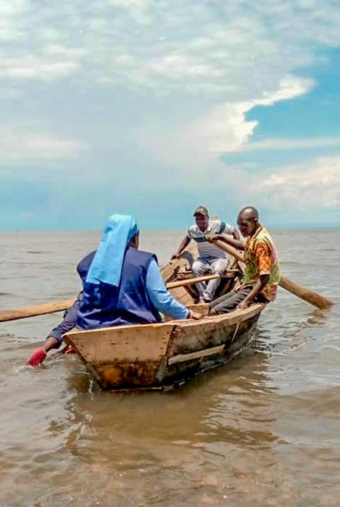 Sr. Angèle Gapio crosses a river in a canoe to meet the rebels to seek possibilities of peaceful negotiations within Congo (Courtesy of Dieu Donne, Pax Christi International.)