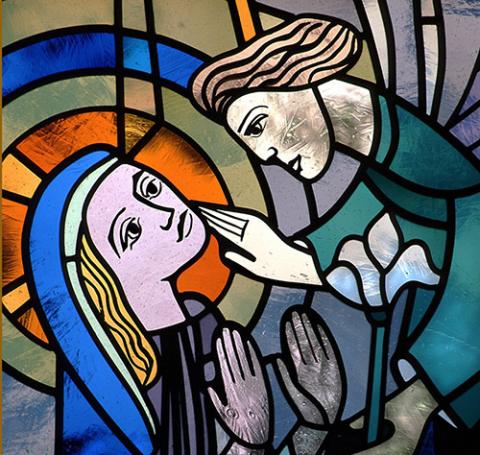 In this church window depicting the Annunciation, the angel Gabriel appears before Mary to proclaim that she is to be the mother of Jesus. The window is from St. Mary's Church in Willmar, Minn. (CNS/Crosiers)