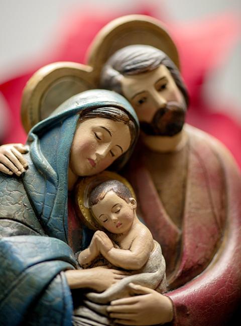 Mary, Joseph and the baby Jesus are depicted in a wooden creche at Sacred Heart Cathedral in Rochester, New York. (CNS/Catholic Courier/Mike Crupi)