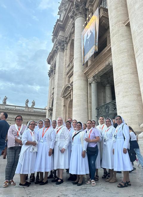 The congregation of the Little Sisters of the Holy Family gather under Paradis’ painting on the day of her canonization (Courtesy of Rachel Lemieux)