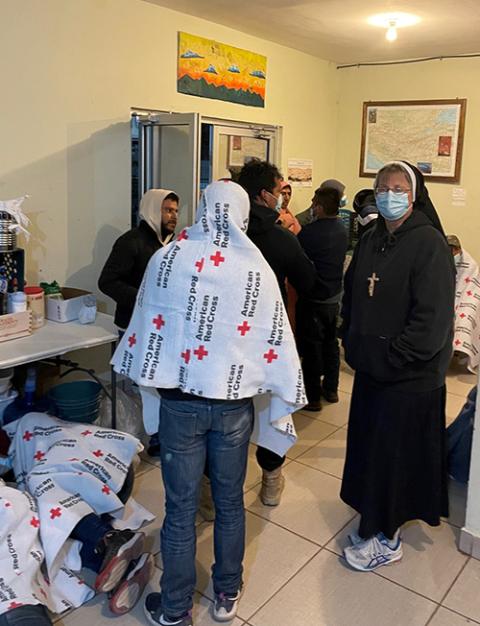 Felician Sr. Maria Louise Edwards, right, welcomes returned migrants to the Migrant Resource Center in Agua Prieta, Mexico. (Peter Tran)