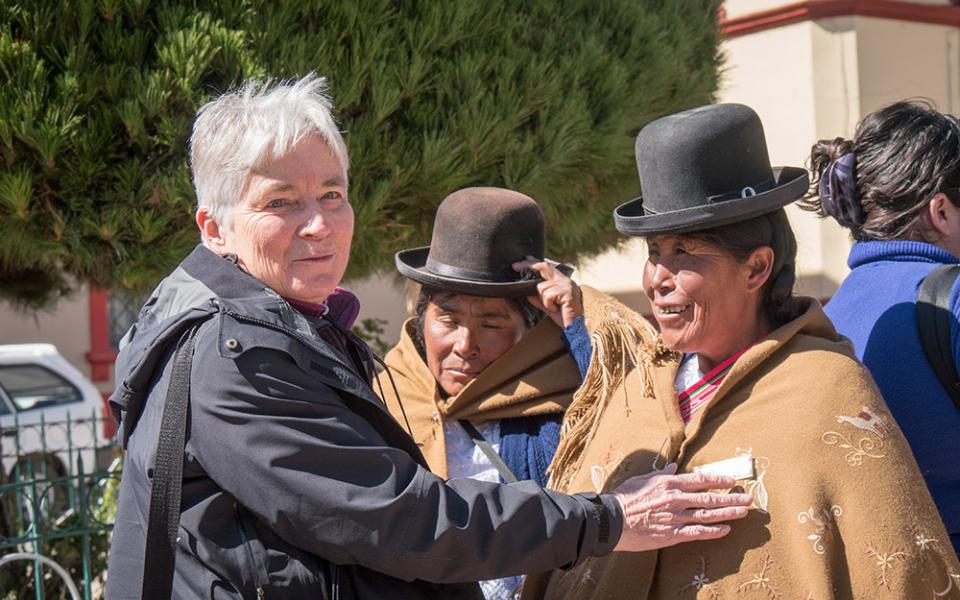 In this 2016 photo, Maryknoll Sr. Patricia Ryan speaks with Lucila Ticona Vda. de Laura and other Aymara community leaders, in an Acción de Amparo, at Plaza de Armas, Puno City, Puno Department, Peru. (Courtesy of Maryknoll Magazine/Nile Sprague)