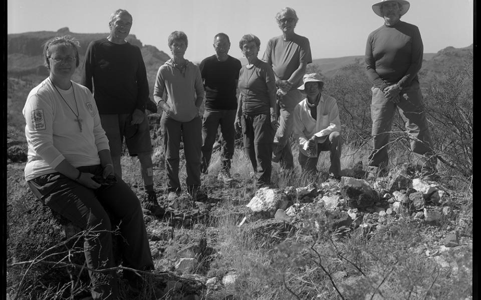 A group of Ajo Samaritans and volunteers pause for a moment before returning to Ajo town after spending half a day dropping off water and food for migrants in the Sonoran Desert of Arizona.