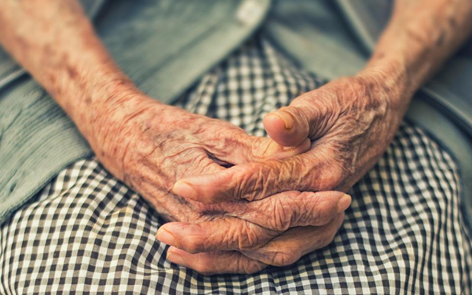 An elder adult's hands are displayed in this photo illustration. (Unsplash/Danie Franco)