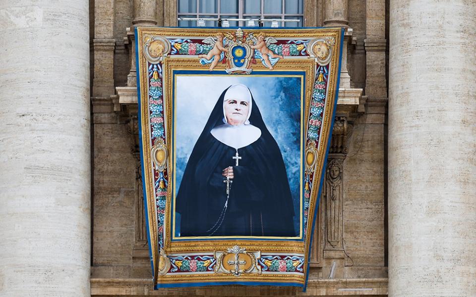 A banner depicting Canada-born Blessed Marie-Léonie Paradis, founder of the Little Sisters of the Holy Family, is displayed outside St. Peter’s Basilica at the Vatican Oct. 17, ahead of her canonization Oct. 20. (CNS/Lola Gomez)