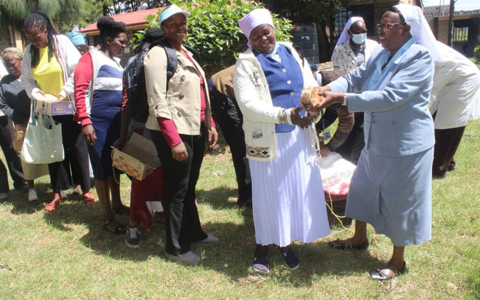 Sr. Florence Muia distributes chicks to her clients in Upendo Village, located in Naivasha, a town northwest of Nairobi, the capital of Kenya. (Courtesy of Upendo Village)