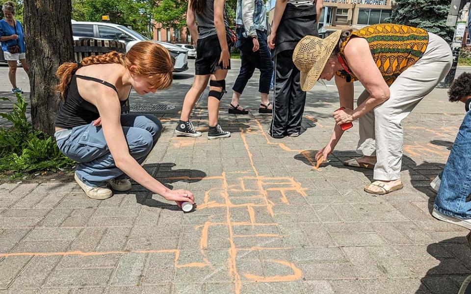 Talitha Kum ambassadors in Montreal take part in the activity "Agissons enSable," using colourful sand as a symbol of the vulnerable population at risk of falling between the cracks (Courtesy of IsaBelle Couillard)