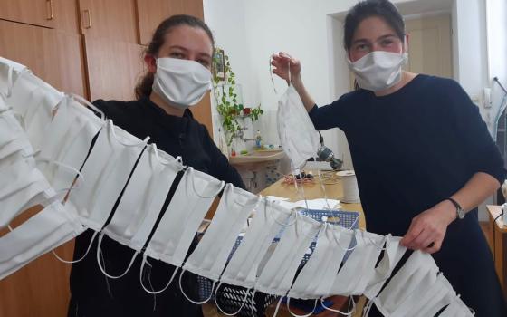 Candidates of Sisters of Mercy of the Holy Cross in Djakovo, Croatia, show a string of masks they have sewn to share with the people in the communities they serve. (Sr. Valerija Široki)