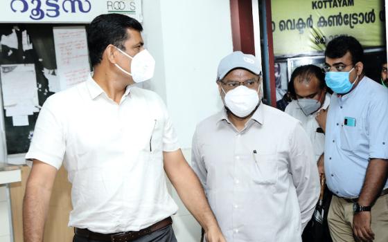 Bishop Franco Mulakkal of Jalandhar, center, in a light-colored cap, exits the Additional District and Sessions Court in Kottayam, Kerala, Aug. 13, 2020, after he was formally charged with raping and intimidating a Catholic nun. (M.A. Salam)