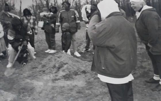 An outing for the residents of Dehon House in 1995. Dominican Sr. Lois McGovern is watching from the far right, as the residents plant a tree.  (Provided photo)