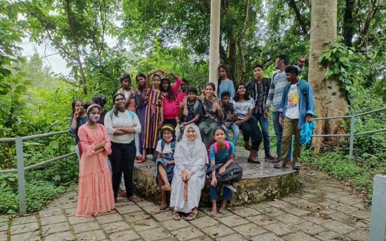 Sr. Soumitha Chittilappilly of the Sisters of the Destitute sits in front with children of Udaya Colony during a field trip in Kochi city in Kerala, India. (Courtesy of Soumitha Chittilappilly)