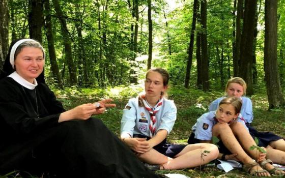 Mahdalyna Nadiya Vytvytska (left) meets with Girl Scouts at a 2020 summer camp session in Ukraine. She serves as assistant chaplain. (Courtesy of Mahdalyna Nadiya Vytvytska)