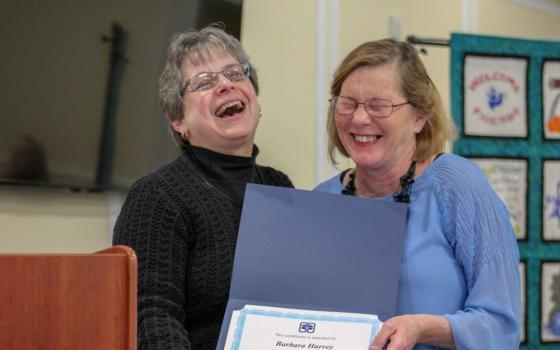 Sr. Robbie Pentecost (left), executive director of the New Opportunity School for Women in Berea, Kentucky, presents Barbara Harvey with a completion certificate from NOSW's two-week residential program in 2018. 