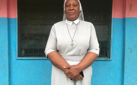 Sr. Matilda Iyang poses outside at the Mother Charles Walker Children Home Oct. 7, at the Handmaids of the Holy Child Jesus convent in Uyo, Nigeria. (CNS/Valentine Iwenwanne)