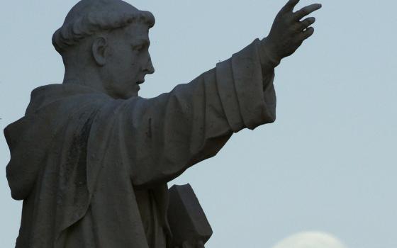 A statue of St. Dominic is seen outside the Dominican House of Studies in Washington. (CNS/Bob Roller)