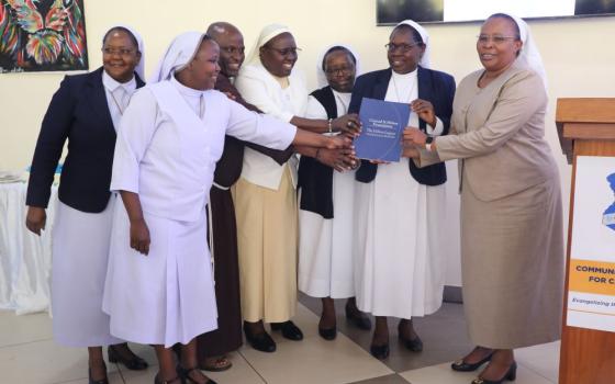 Sr. Jane Wakahiu (right) and religious sisters participated in the launch of the Communications Network for Catholic Sisters in Nairobi, Kenya, on June 14. Wakahiu holds a book that outlines a code of conduct for sister communicators and resources to help them improve their journalistic skills. (Courtesy of AOSK)