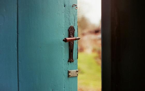 A open blue door (Unsplash/Jan Tinneberg)