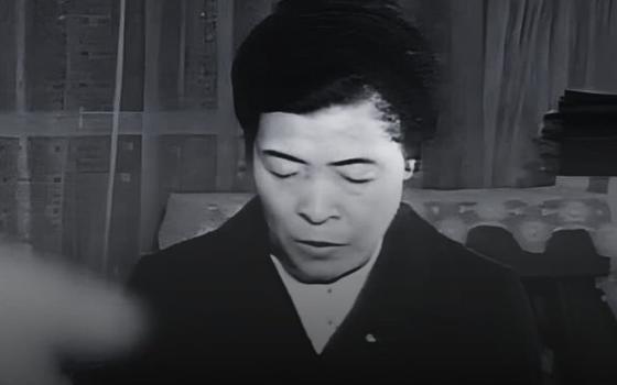 A black and white photograph of Sr. Agnes, labeled with her name, her title as "Visionary of Our Lady of Akita," and the dates of her birth and death. 