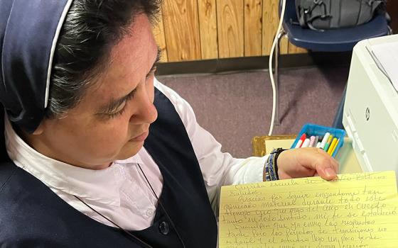 Missionary Servant of the Word Sr. Elsa Narváez Rodríguez shows an inmate's letter in which he thanks the team for the Bible study material and updates them with his new jail address. "During all this time, I have grown in every way, mi fe se estableció" — my faith was established, he wrote. (GSR photo/Luis Donaldo González)