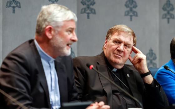 Cardinal Joseph W. Tobin of Newark, N.J., looks on at the Vatican Oct. 11 as Bishop Shane Anthony Mackinlay of Sandhurst, Australia, speaks at a press briefing on the synod. Tobin, Chicago Cardinal Blase Cupich and San Diego Cardinal Robert McElroy met with Pope Francis Oct. 10. The trio has not made public what they discussed at the meeting. (CNS photo/Lola Gomez)