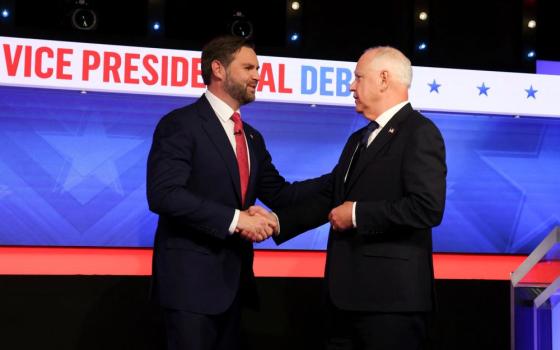 Republican vice presidential nominee Sen. JD Vance of Ohio and Minnesota Gov. Tim Walz, the Democratic vice presidential nominee, greet each other before taking part in their first and only debate at the CBS Broadcast Center in New York City Oct. 1. (OSV News/Reuters/Brendan McDermid)