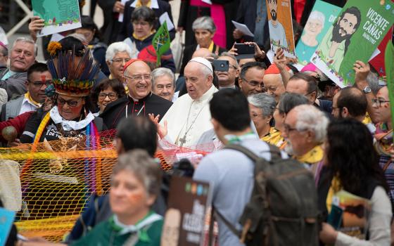 Pope Francis is pictured with Cardinal Pedro Barreto Jimeno of Huancayo, Peru, during a procession at the start of the first session of the Synod of Bishops for the Amazon at the Vatican Oct. 7, 2019. (CNS/Vatican Media)