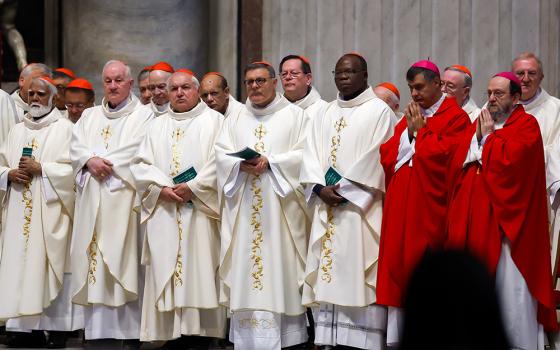 Cardinals pray during Mass presided by Cardinal Mario Grech, secretary-general of the Synod, at the Altar of the Chair in St. Peter’s Basilica at the Vatican Oct. 21, 2024. (CNS/Lola Gomez)