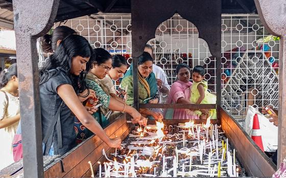 Devotees light candles at the St. Alphonsa Pilgrim Centre in Bharananganam in the Palai Diocese, southwestern India. (Thomas Scaria)