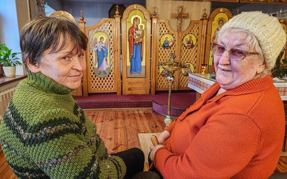 Diakova Lubov, 58, left, and Petrova Yevdokia, 80, right, two women displaced during Russia’s full-scale invasion of Ukraine, visit the chapel of the convent of the sisters of the Order of St. Basil the Great in Zaporizhzhia, Ukraine. (GSR photo/Chris Herlinger)