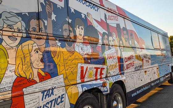 The bus for the Nuns on the Bus & Friends tour, organized by faith-based political advocacy group Network Lobby for Catholic Social Justice, is seen at its Las Vegas stop Oct. 14. (Alecia Westmorland)