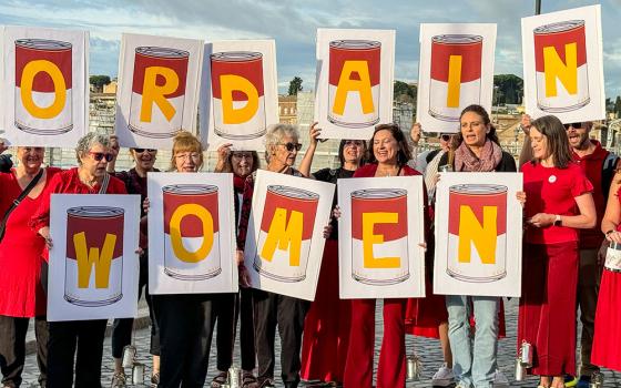 Members of the Women’s Ordination Conference, Women’s Ordination Worldwide, Roman Catholic Womenpriests-USA gather near the Vatican to pray for the Catholic Church to open up the priesthood to women as the worldwide consultation known as the synod begins Oct. 2. (GSR photo/Rhina Guidos)