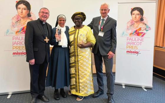 Auxiliary Bishop Ludger Schepers, left, of the Diocese of Essen, Germany, poses for a photo with Sr. Lorena Jenal, to his right, Rakieta Poyga, of Burkina Faso, and Gregor von Fürstenberg, vice president of Missio Aachen, Oct. 13, 2024 during an awards ceremony in Germany. Jenal received a lifetime achievement award from Missio Aachen for her ministry among victims of "sorcery accusation related violence" in Papua New Guinea. (Courtesy of Missio Aachen)