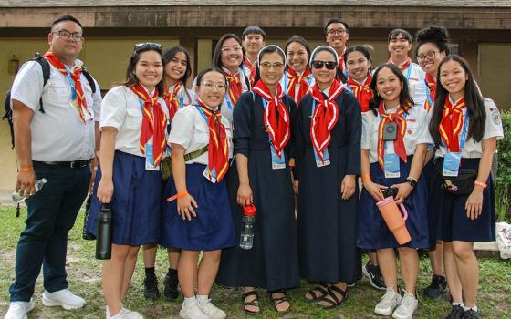 Sisters Kimberly and Thérèse from the Lovers of the Holy Cross in Los Angeles take a group photo with various members of the Vietnamese Eucharistic Youth Movement at the national convention in High Springs, Florida, in August. (VEYM Photography Team via Facebook)