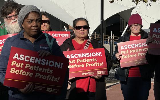 Nurses rally outside the fall meeting of the U.S. Conference of Catholic Bishops Nov. 12 in Baltimore, asking bishops to urge the Catholic hospital chain Ascension for better staffing and patient care. (NCR photo/Rhina Guidos)