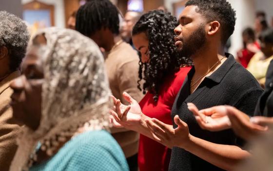 Worshippers pray during a Black Catholic History Month Mass in November at the Cathedral of St. Thomas More in Arlington, Virginia. (BCM/Catholic Herald/Jim Hale)