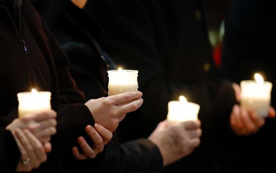 People hold candles at Mass with Pope Francis on the feast of the Presentation of the Lord and the World Day for Consecrated Life in St. Peter's Basilica at the Vatican Feb. 2, 2024. GSR is celebrating the 2025 World Day of Consecrated Life with a special event on Thursday, Jan. 30. (CNS/Lola Gomez)