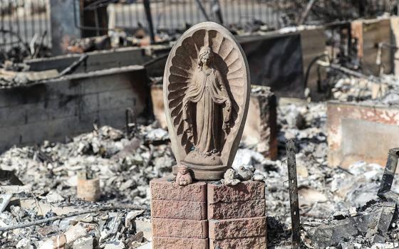 A statue of Mary rests nearly untouched in the rubble of a destroyed home in Altadena, Calif., Jan. 17, 2025, in the aftermath of the Eaton Fire, which began Jan. 7. (OSV News/Bob Roller)