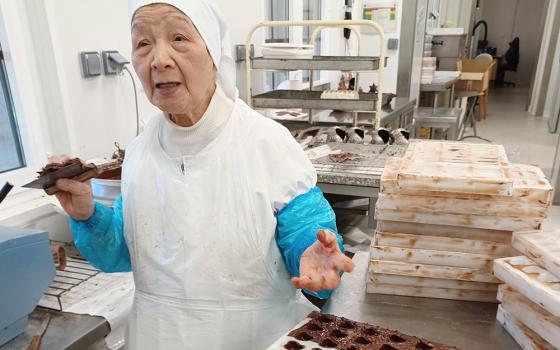 Sister Emmanuel, in her 80s, loves her job in the chocolate factory of the Cistercian sisters at Notre Dame de la Paix. (Elisabeth Auvillain)