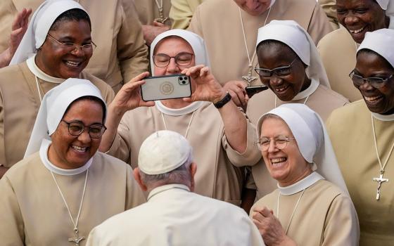 Pope Francis meets a group of nuns during his weekly general audience in the Pope Paul VI Hall at the Vatican, on Aug. 30, 2023. (AP/Andrew Medichini, File)