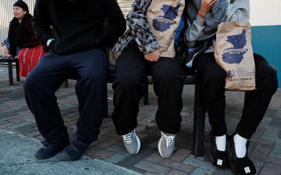 Migrants are seen outside a repatriation center in Guatemala City, Guatemala, after arriving on a deportation flight from the U.S. that landed at La Aurora Air Base Jan. 27, 2025. (OSV News/Reuters/Josue Decavele)