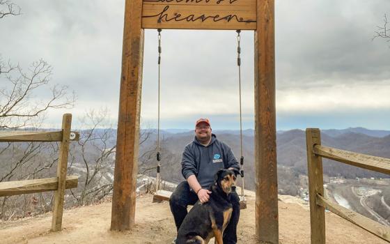 Br. Christian Matson hikes with his dog, Brother Odilo ("Odie"), in West Virginia. (Courtesy of Christian Matson)